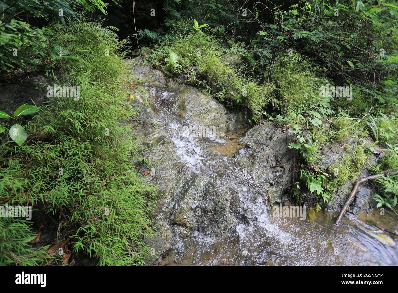 River and water falls runs on sediment rocks at West Java Indonesia ...