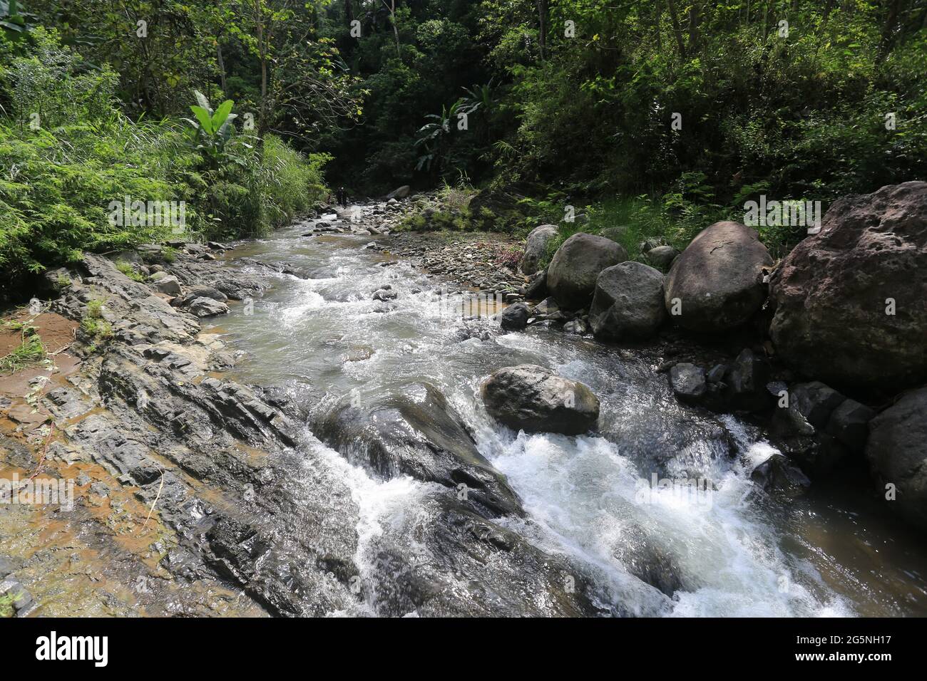 River and water falls runs on sediment rocks at West Java Indonesia ...