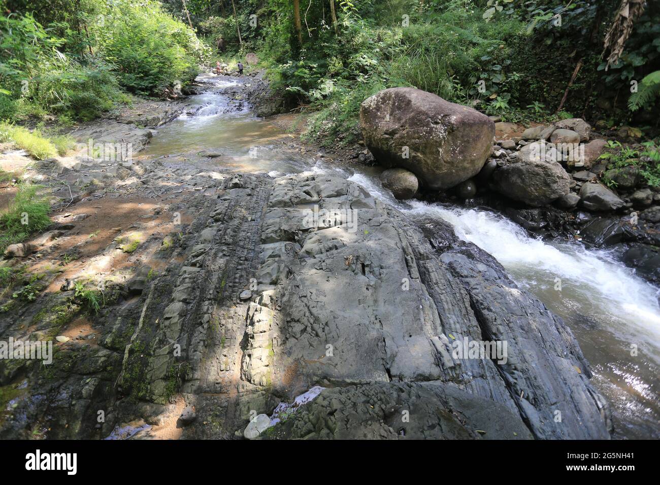 River and water falls runs on sediment rocks at West Java Indonesia ...