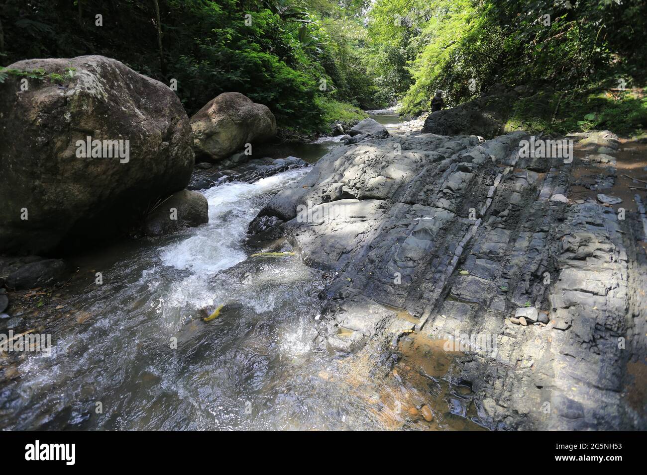 River and water falls runs on sediment rocks at West Java Indonesia ...