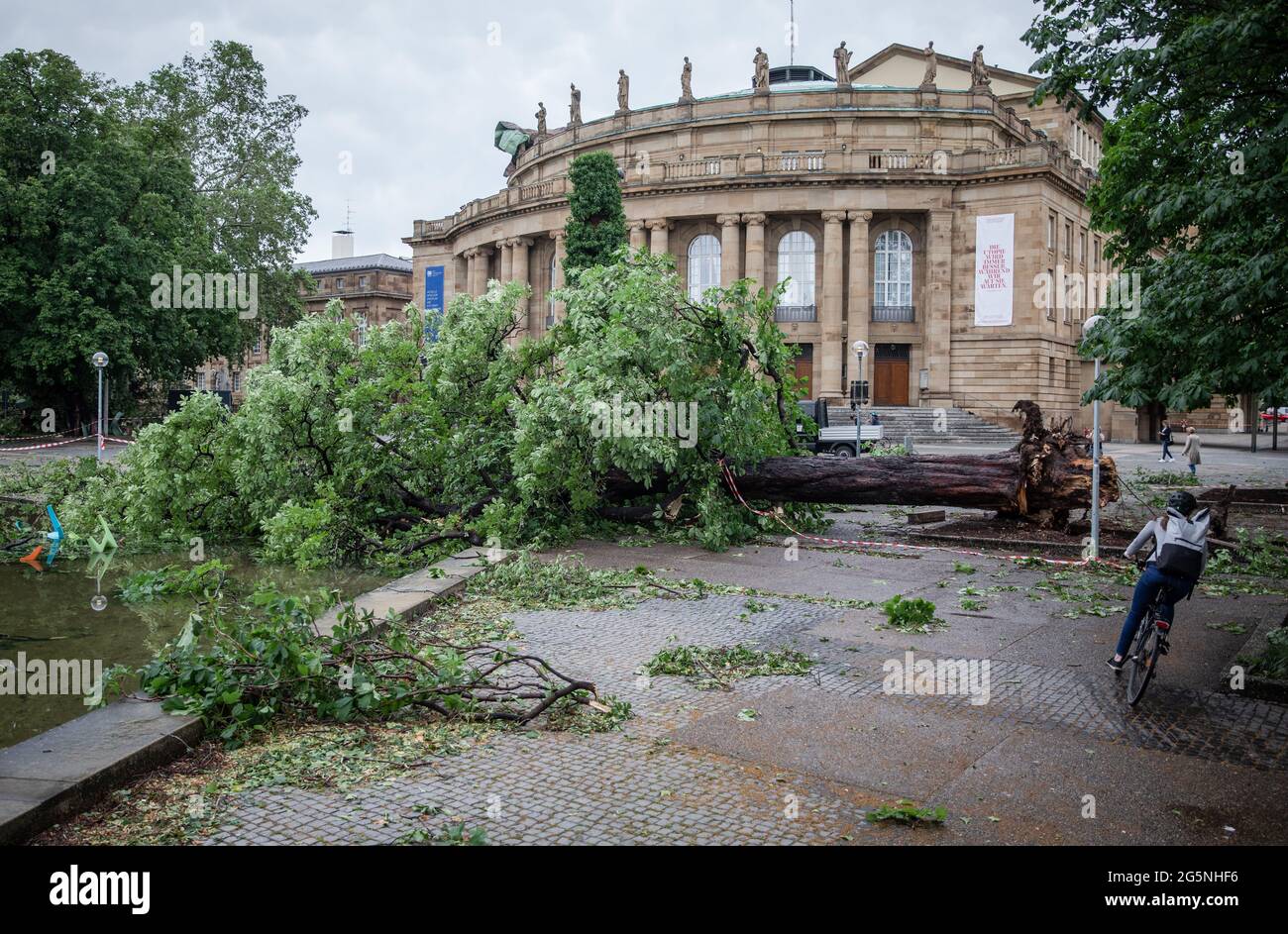 Stuttgart, Germany. 29th June, 2021. A fallen tree lies in front of the ...