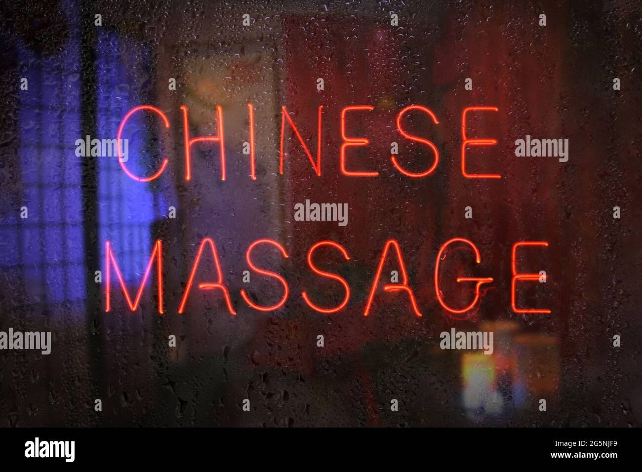 Vintage Neon Sign in Window Asian Massage Stock Photo