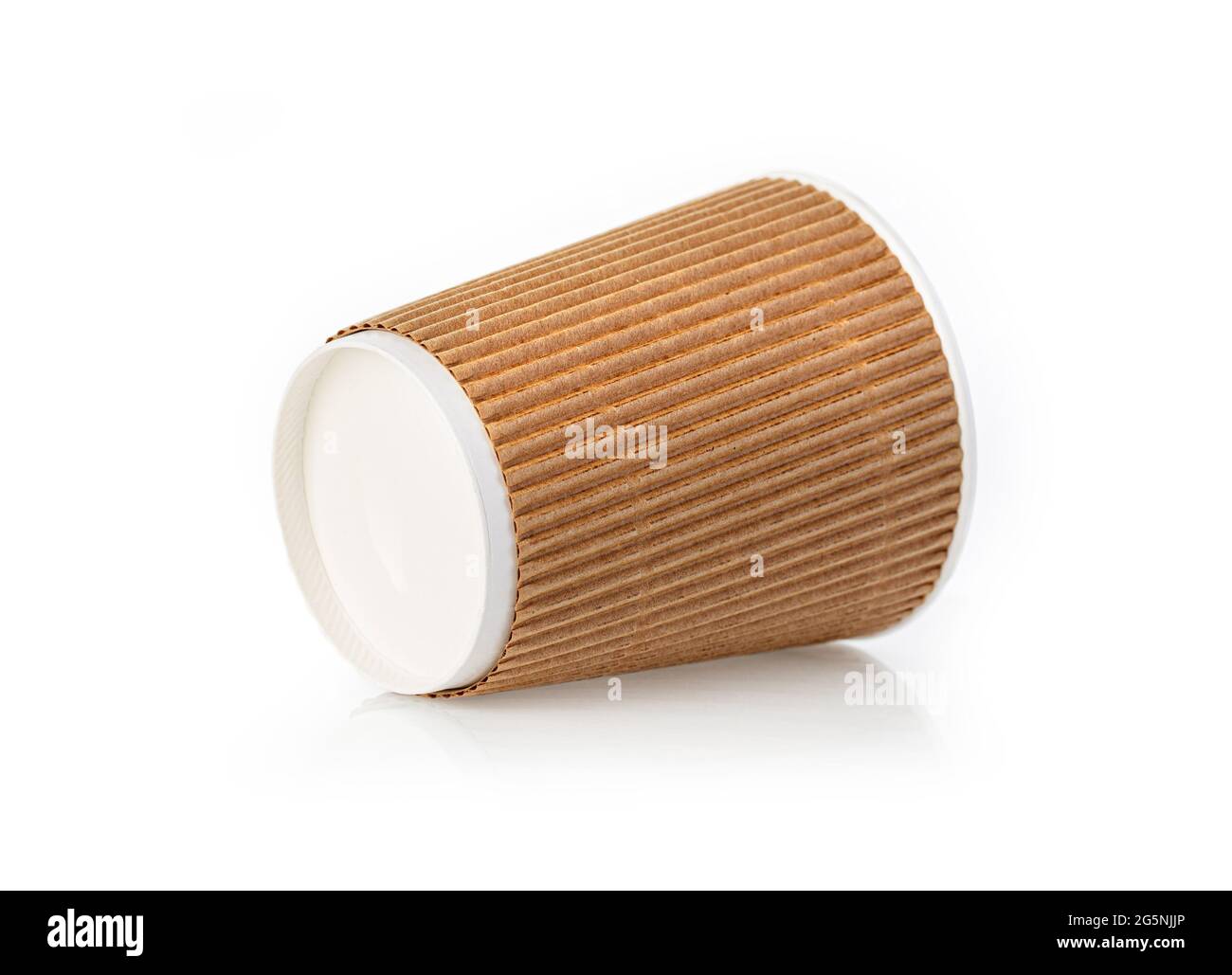 a paper coffee cup sits on a white table Stock Photo