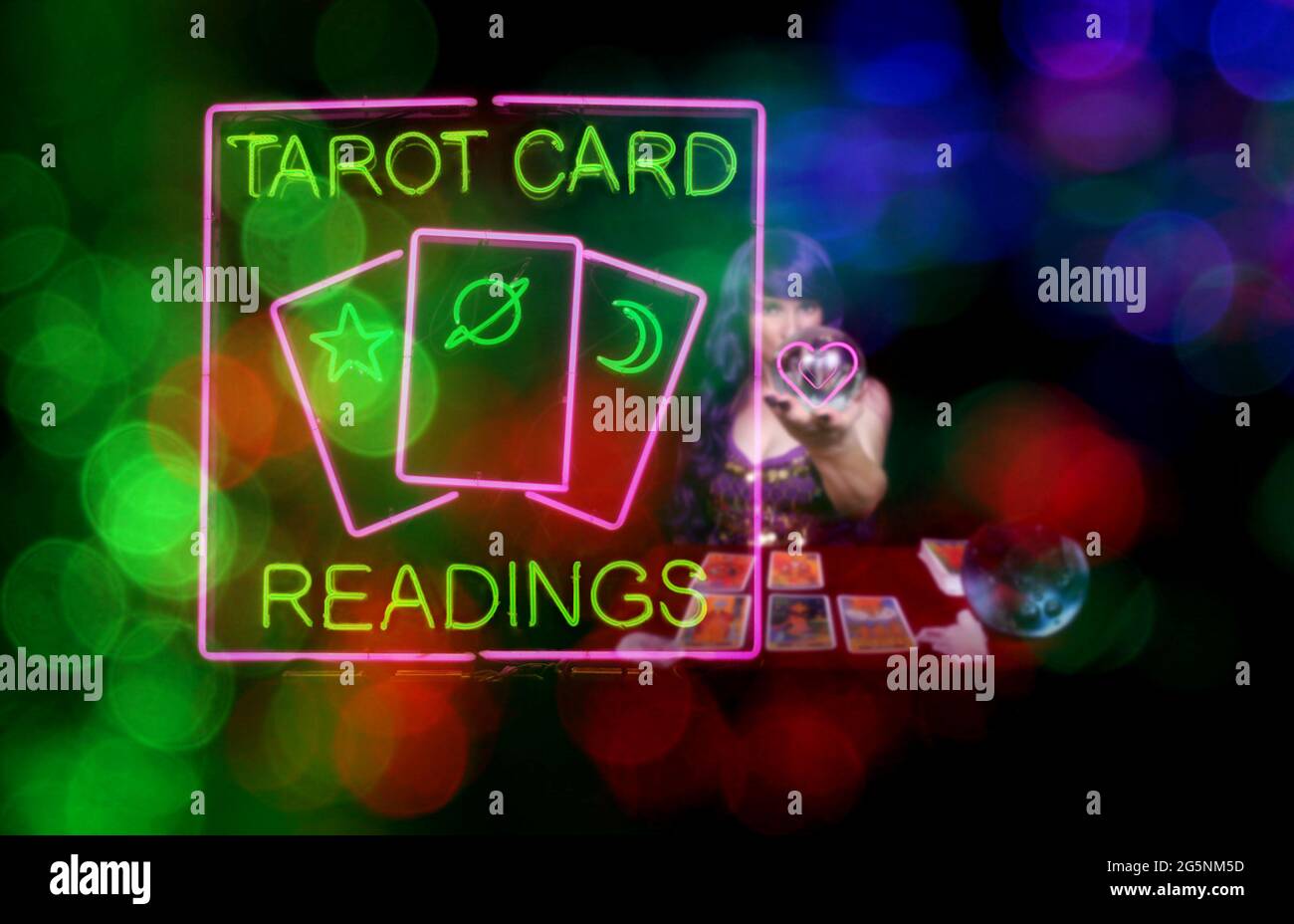 Tarot Card Readings Sign with Psychic Card Reader in background Stock Photo