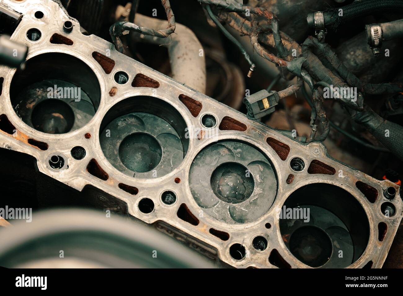 Pistons and cylinder head of engine block vehicle. Motor capital repair.  Sixteen valve and four cylinder.