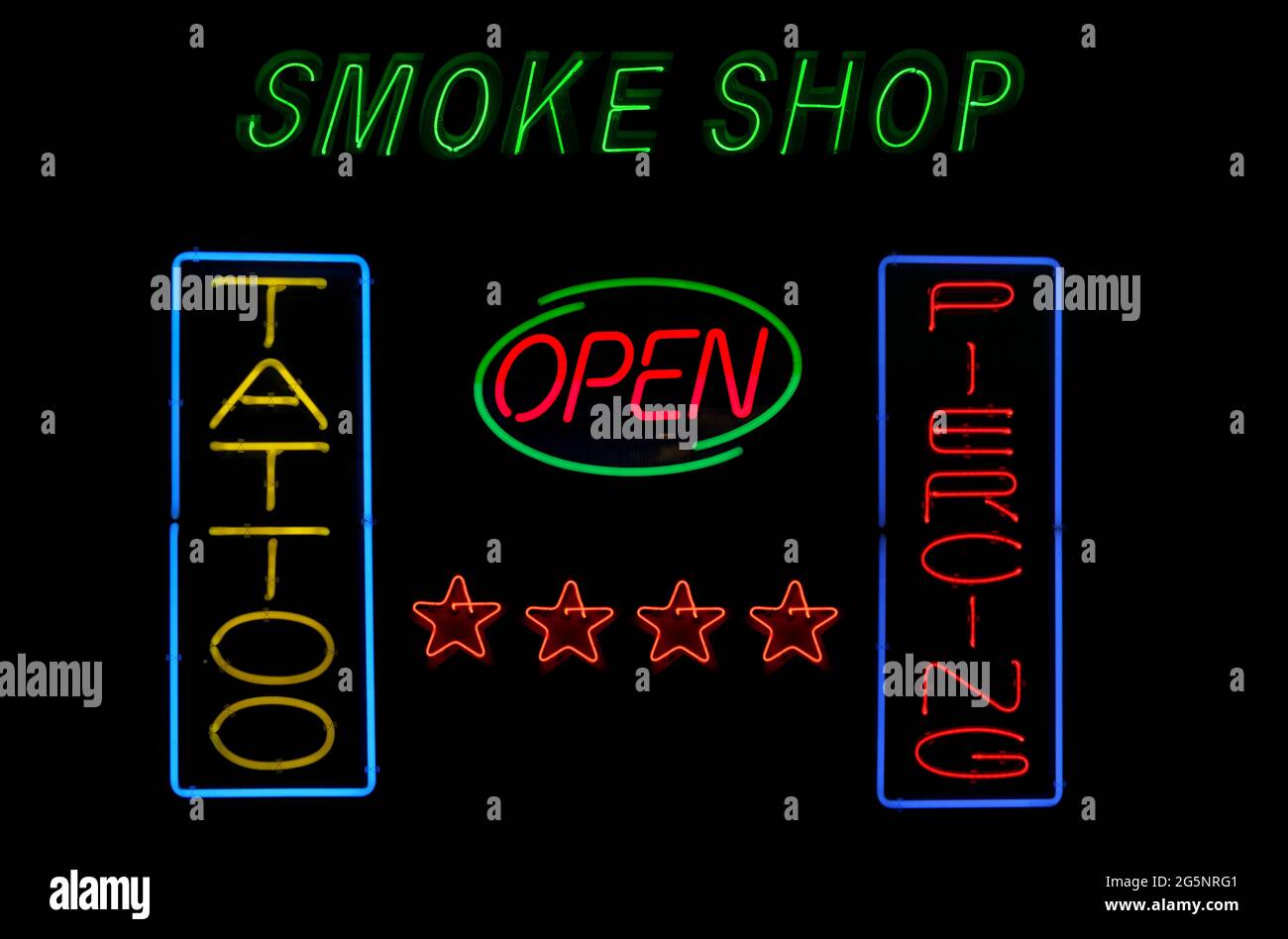 Vintage Neon Sign Tattoo, Piercing and Smoke Shop Stock Photo