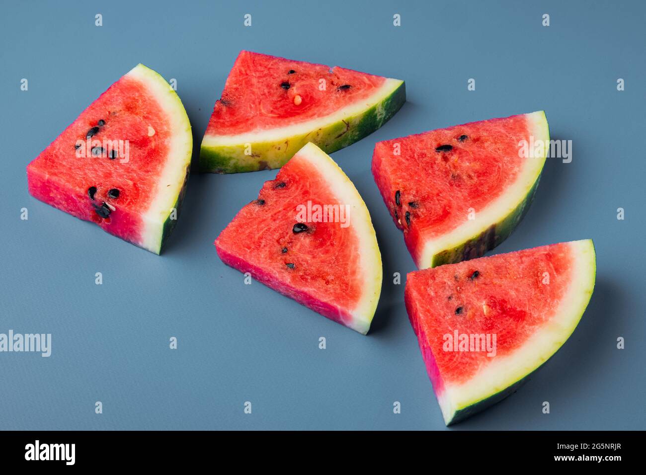 Fresh cut watermelon set, on blue textured summer background Stock ...