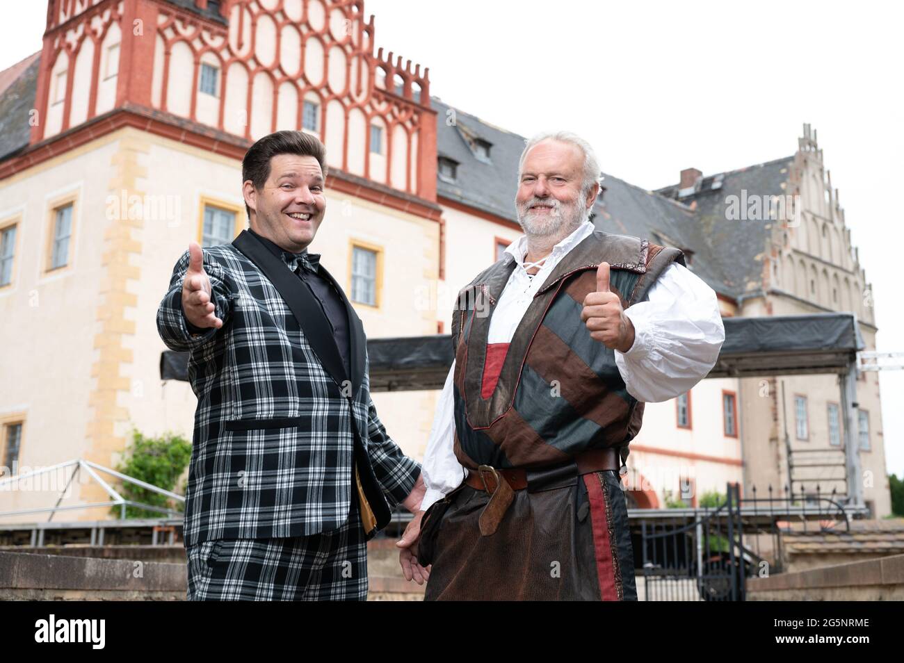 Grimma, Germany. 29th June, 2021. Konrad Schöpe (l), musician Firebirds, and Jochen Rockstroh, lord of the castle, stand at a stage in front of Trebsen Castle. From 02 to 04 July 2021, a music festival without distance rules and mask obligation will take place on the grounds of the moated castle as part of a model project. Credit: Sebastian Kahnert/dpa-Zentralbild/ZB/dpa/Alamy Live News Stock Photo