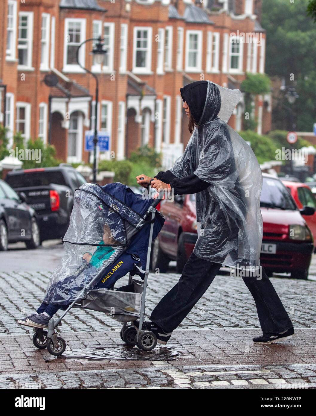 Pic show Wet weather Highgate North London 28.6.21 woman with