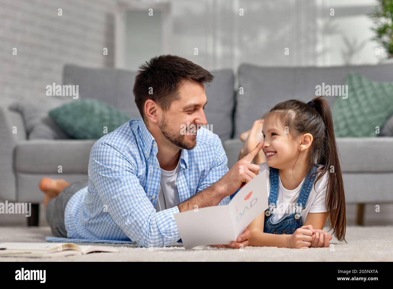 Father's day. daughter giving dad a greeting card Stock Photo - Alamy