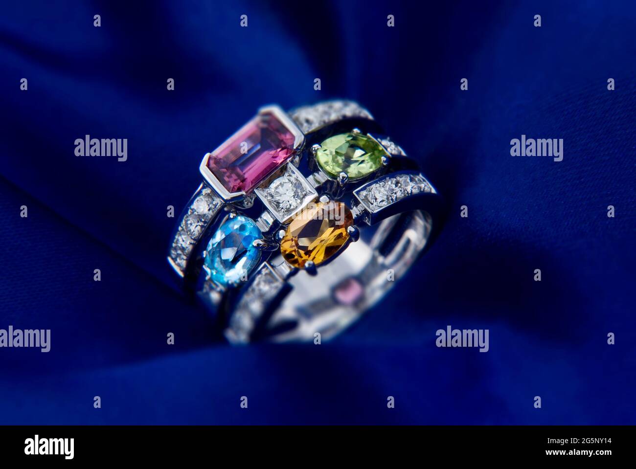 White Gold Ring With Citrine Peridot, Blue Topaz, Pink Tourmaline And Diamonds Stock Photo