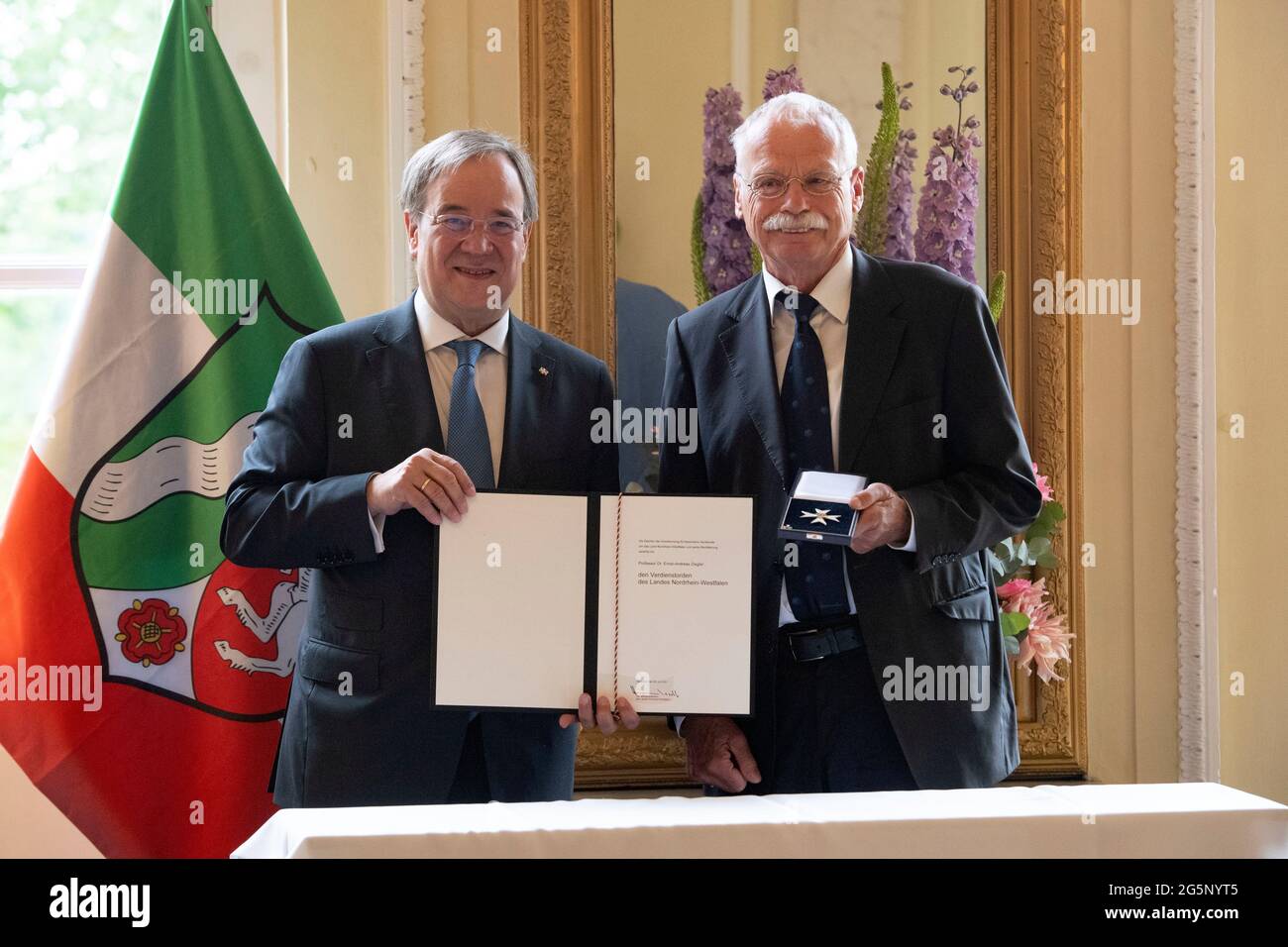 Duesseldorf, Deutschland. 28th June, 2021. Prime Minister Armin LASCHET, honors Prof. Dr. Ernst-Andreas ZIEGLER, grass roots diplomat, from Prime Minister Armin Laschet honors citizens of North Rhine-Westphalia for their exceptional commitment to society with the order of merit of the state, award of the order of merit of the state of North Rhine-Westphalia in Duesseldorf on 06/28/2021 å Credit: dpa/Alamy Live News Stock Photo