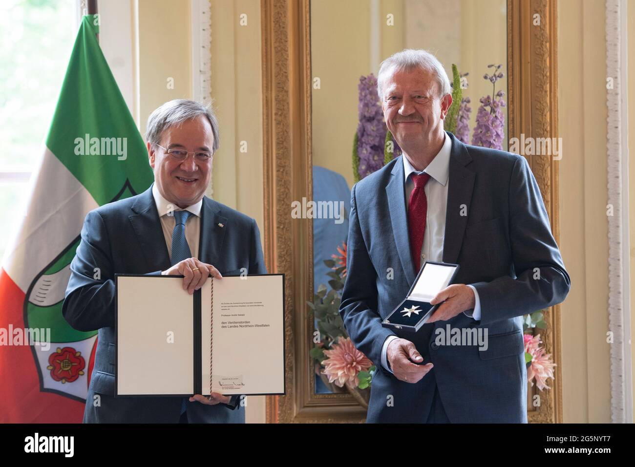 Duesseldorf, Deutschland. 28th June, 2021. Prime Minister Armin LASCHET, honors the musician Professor Andre SEBALD from Prime Minister Armin Laschet honors citizens of North Rhine-Westphalia for their extraordinary commitment to society with the Order of Merit of the State, award of the Order of Merit of the State of North Rhine-Westphalia in Duesseldorf on June 28, 2021 å Credit: dpa/Alamy Live News Stock Photo