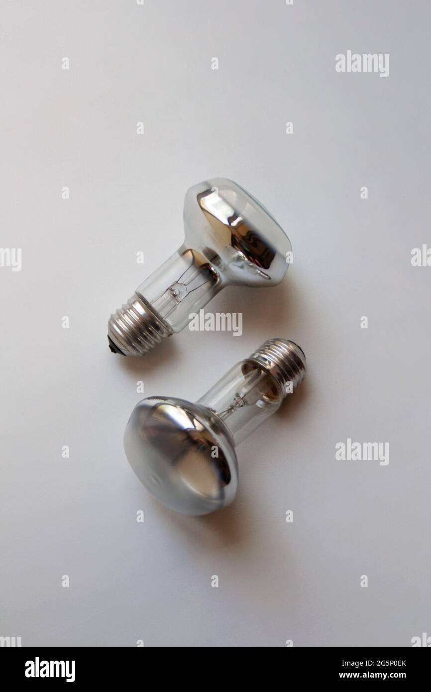 Two silver incandescent light bulbs isolated on white background Stock Photo