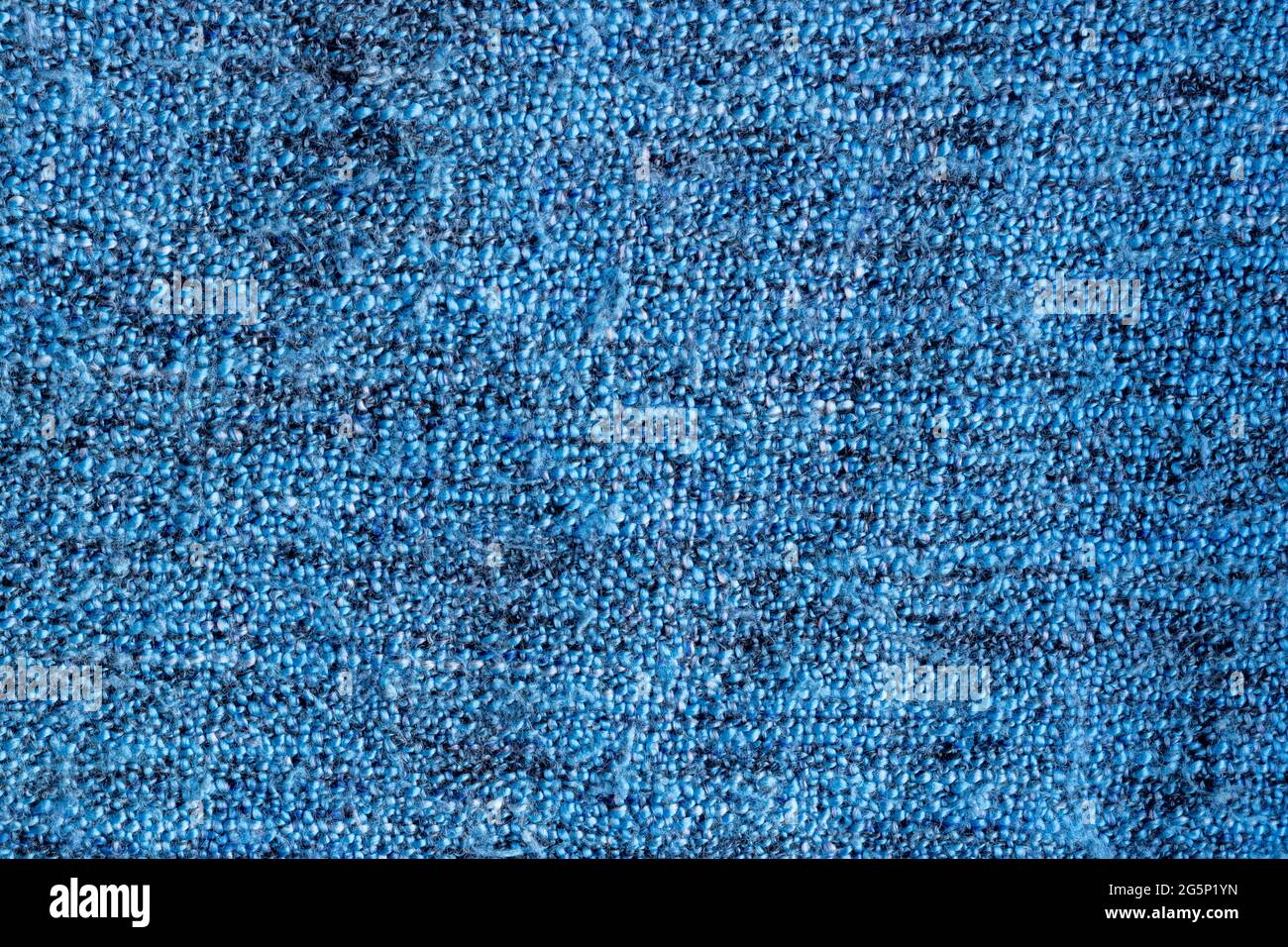Bright blue knitted fabric texture. Rough blanket background Stock