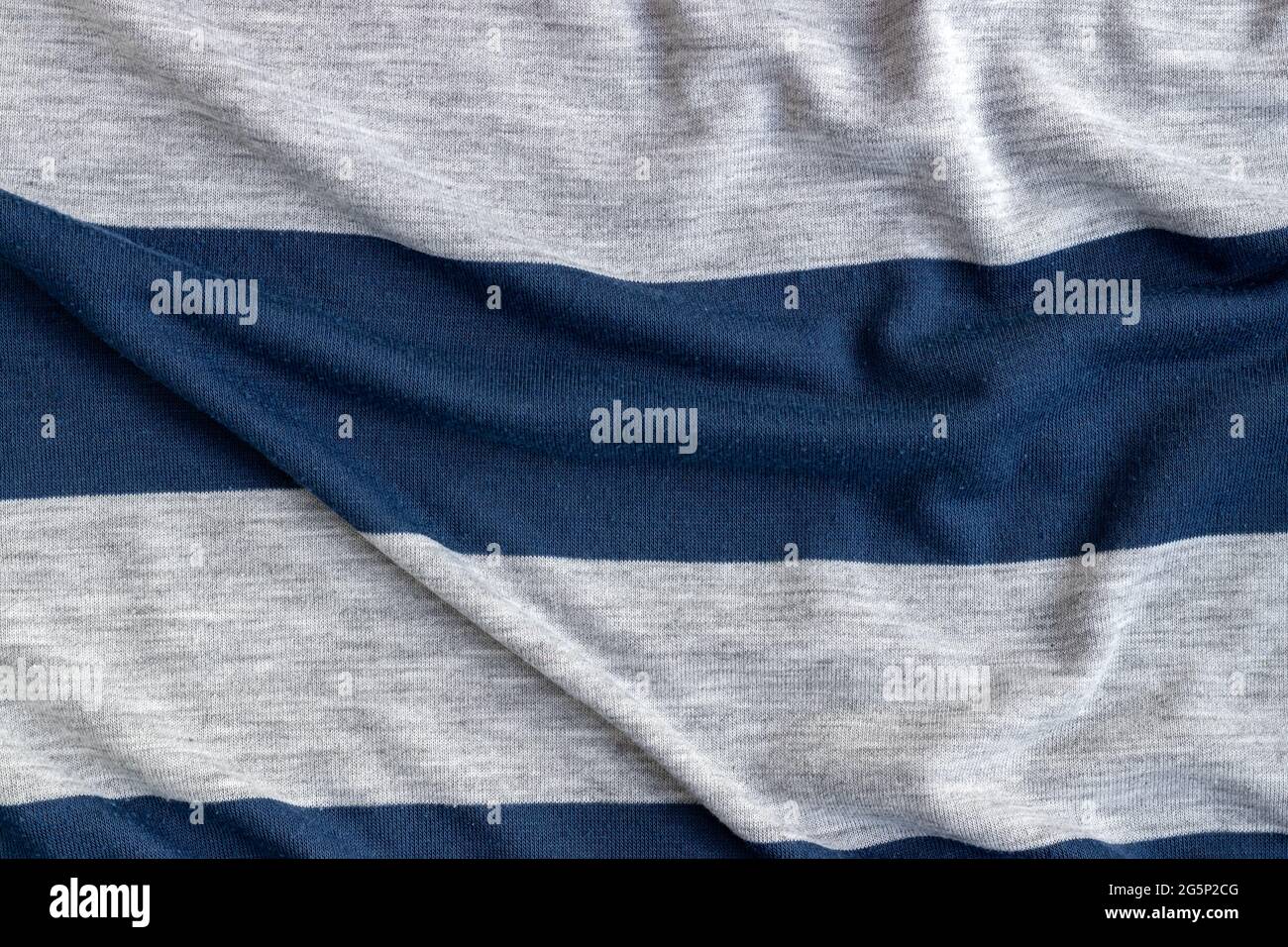 Cotton jersey striped fabric with pills texture. Crumpled blue and gray