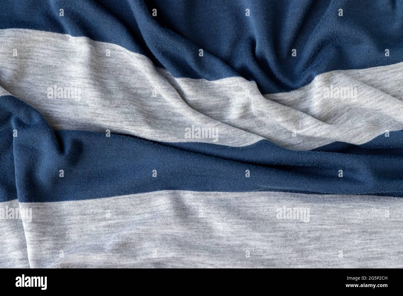 Cotton jersey striped fabric with pills texture. Crumpled blue and gray