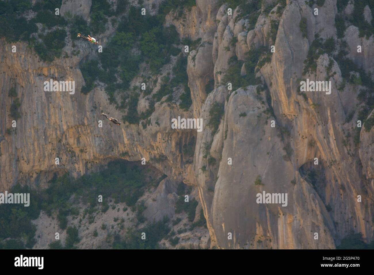 Base-jump jumping in the Verdon gorges, extreme jumping, extreme sport consisting of parachute jumping. Stock Photo