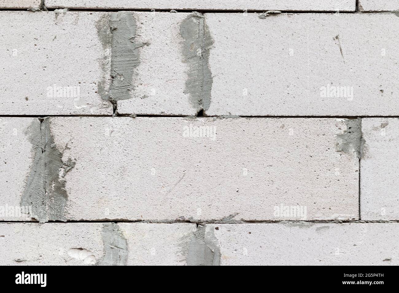 Smooth white brick wall with traces of cement background texture Stock ...