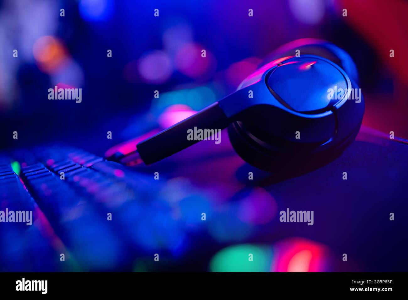 Headphones with microphone for video games and cyber sports on neon