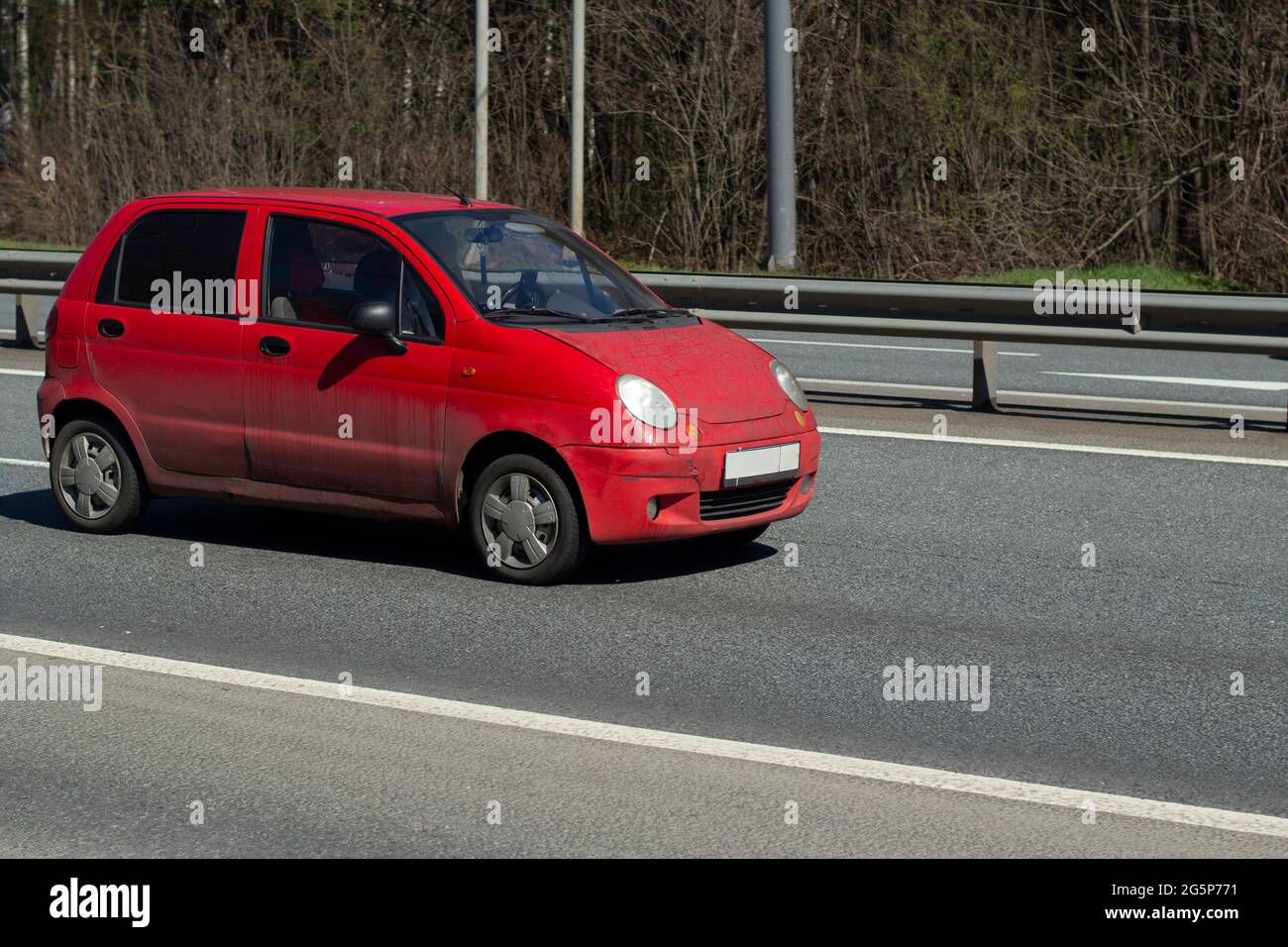 A car on the highway. A car on the road. Personal transport drives on the roadway. Stock Photo