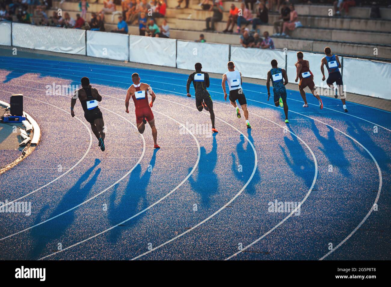 Sprinters running on the athletics Track in sunset light. Shadows on the  track, Sprint, Track and Field photo, original wallpaper for games in Japan  Stock Photo - Alamy