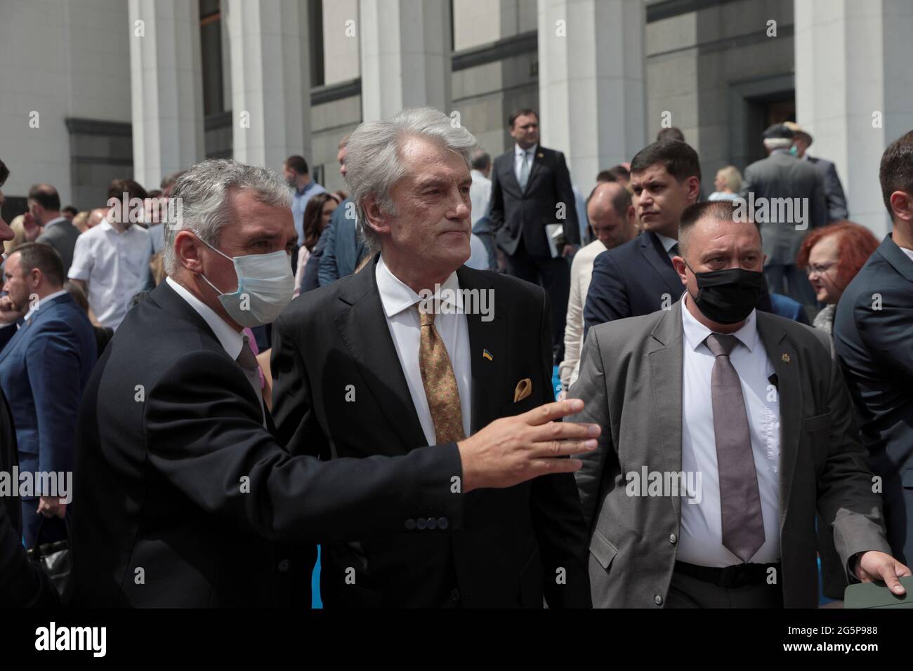 KYIV, UKRAINE - JUNE 28, 2021 - Former President of Ukraine Viktor Yushchenko (C) is pictured outside the Ukrainian parliament building following the Stock Photo