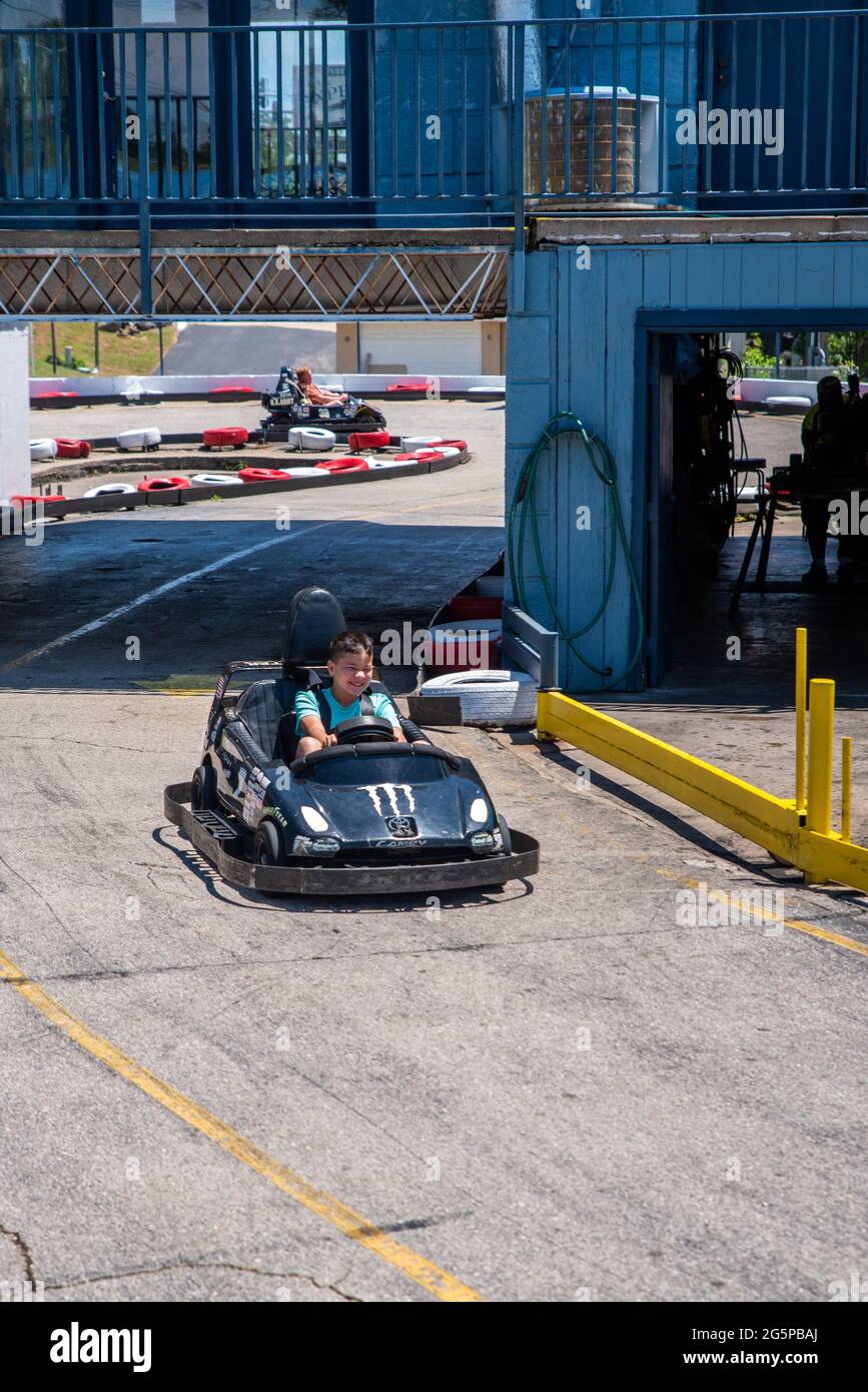 Osage Beach, MO—June 22, 2021; teenage boy drives gas powered go cart