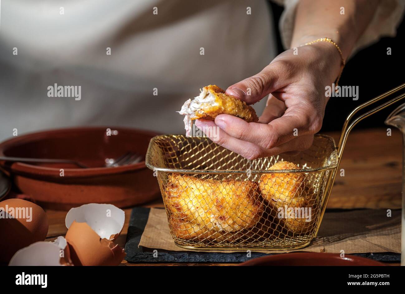 Homemade ham croquette, typical Spanish cuisine recipe, bechamel sauce