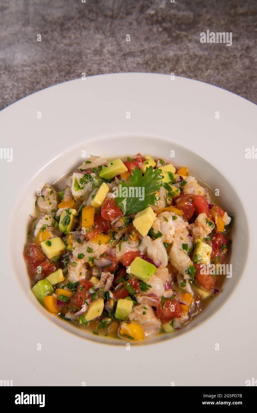 Cod Ceviche recipe, bread in oil and garlic Stock Photo Alamy