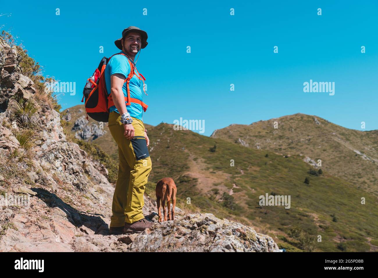 Young male hiker smiling hi-res stock photography and images - Alamy