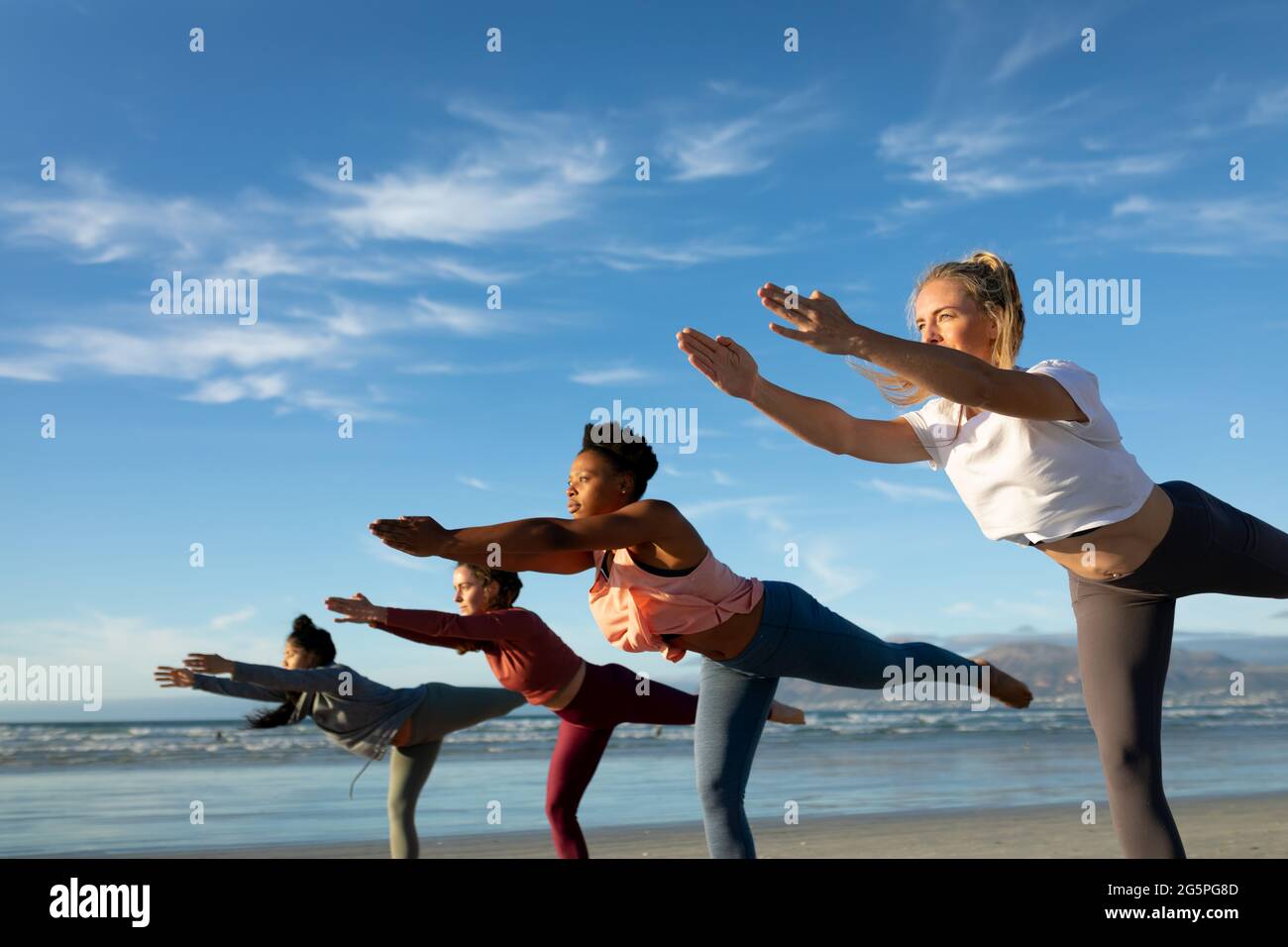 Group of calm relaxed athletes practicing yoga together performing lotus  pose in light modern workout room - a Royalty Free Stock Photo from  Photocase