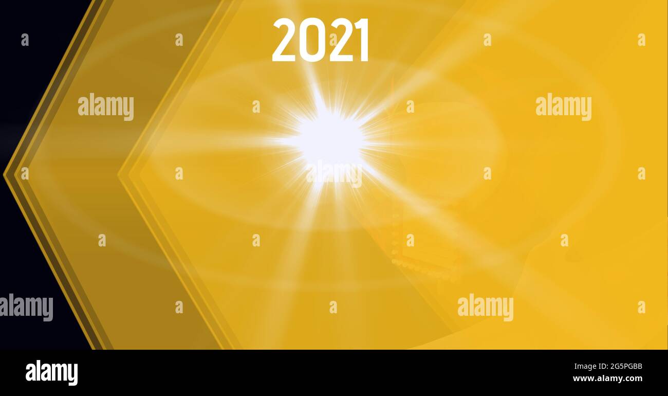 Composition of year 2021 and light flare over translucent layered yellow shapes, on black Stock Photo