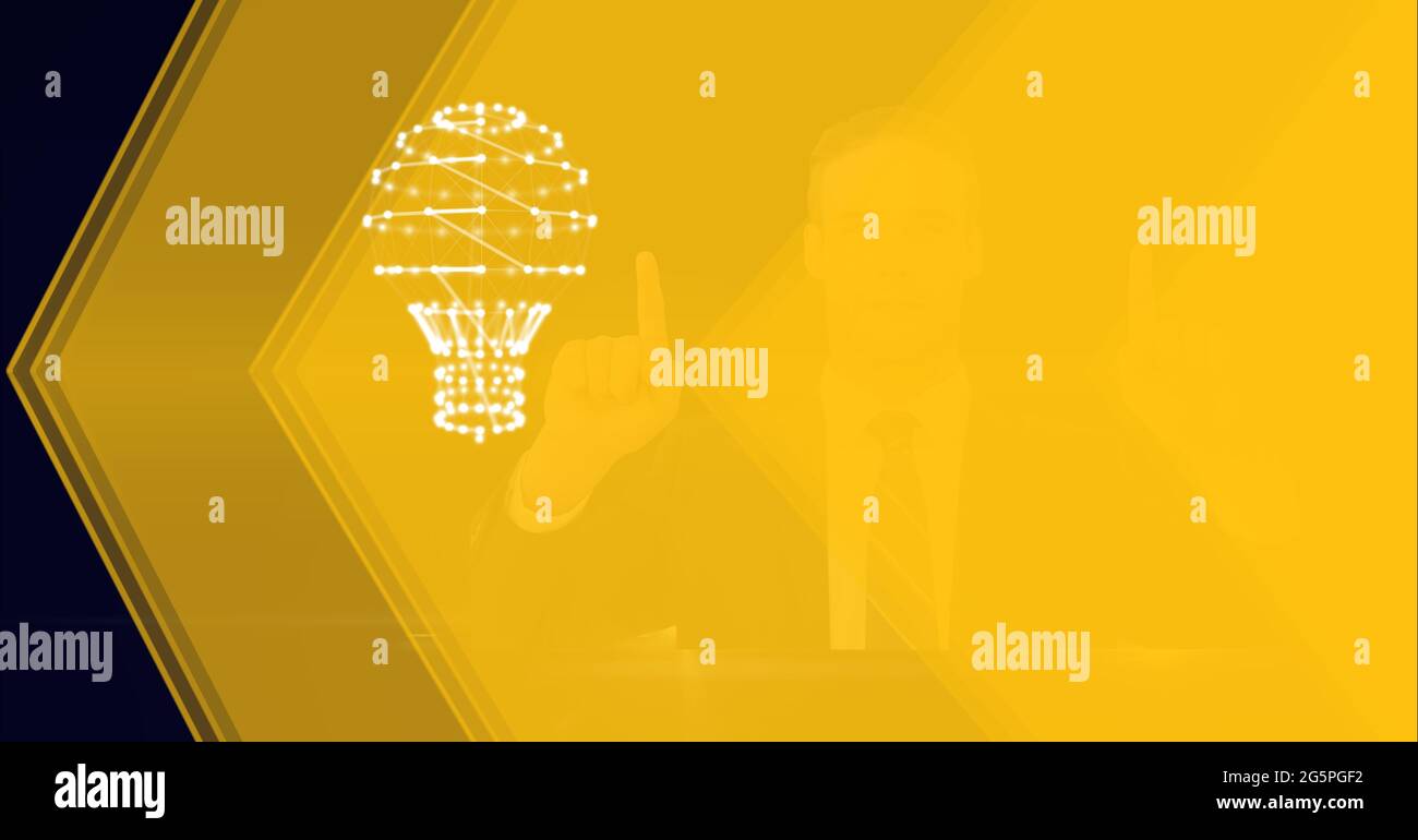 Composition of businessman touching interactive screen with lightbulb Stock Photo