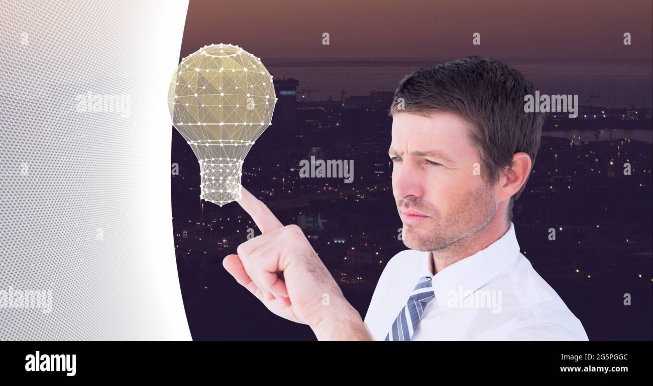Composition of businessman touching interactive screen with lightbulb Stock Photo