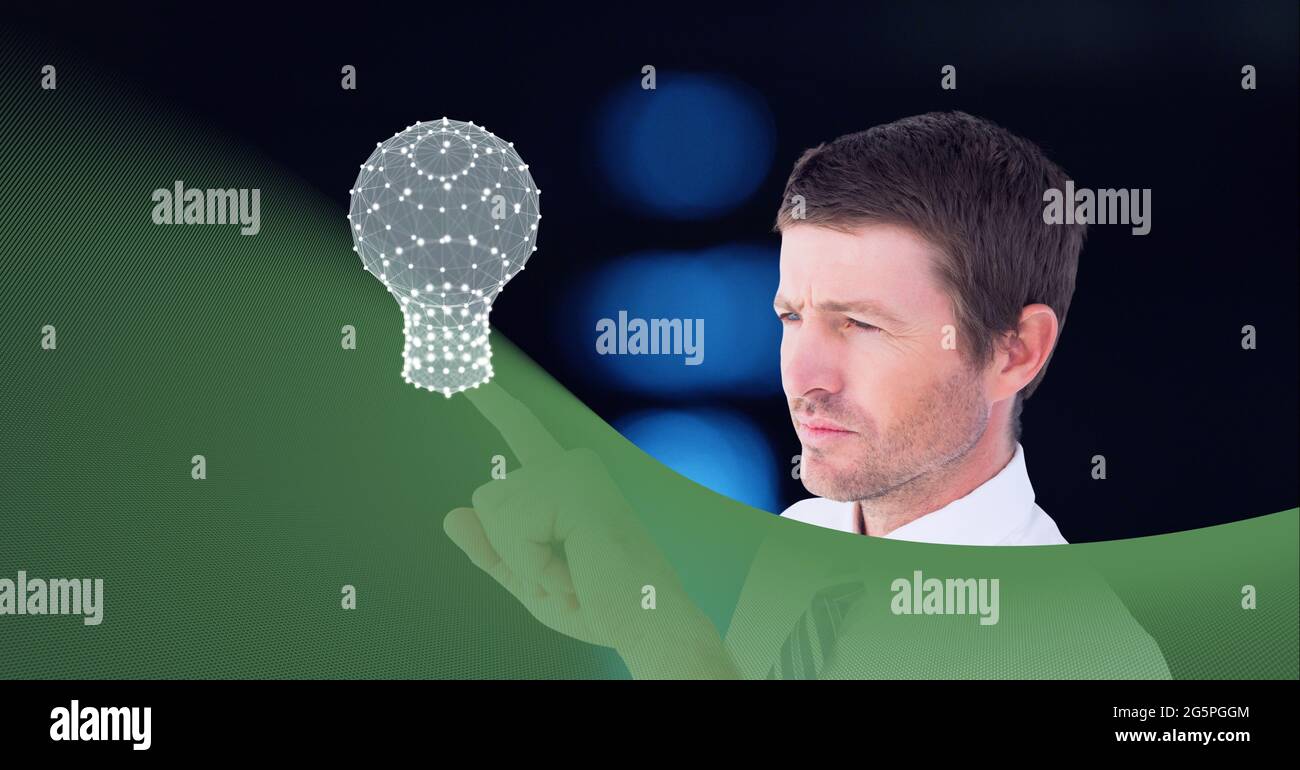 Composition of businessman touching interactive screen with lightbulb Stock Photo