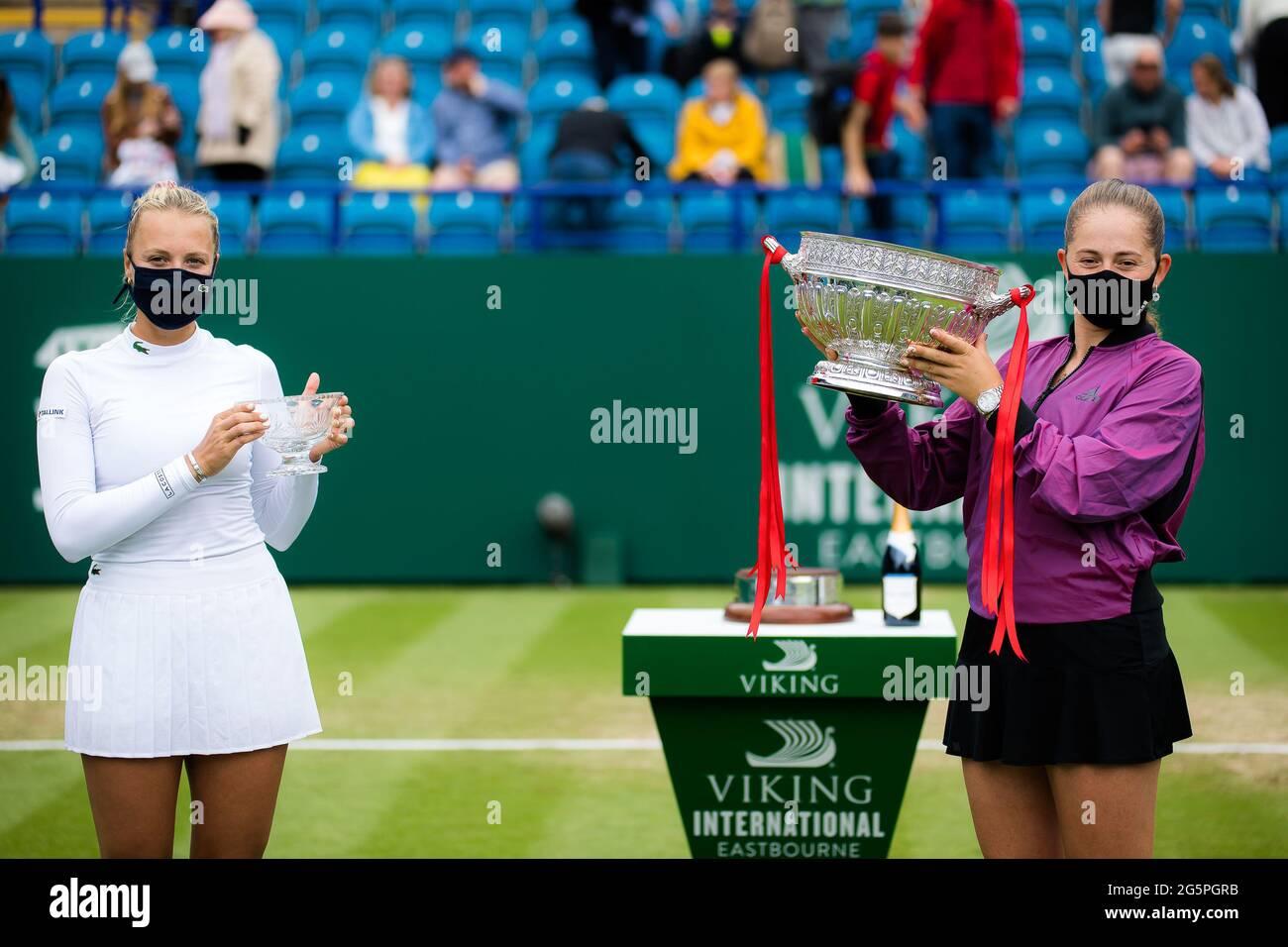 Anett Kontaveit of Estonia and Jelena Ostapenko of Latvia during the trophy ceremony after the final of the 2021 Viking International WTA 500 tennis tournament on June 26, 2021 at Devonshire Park