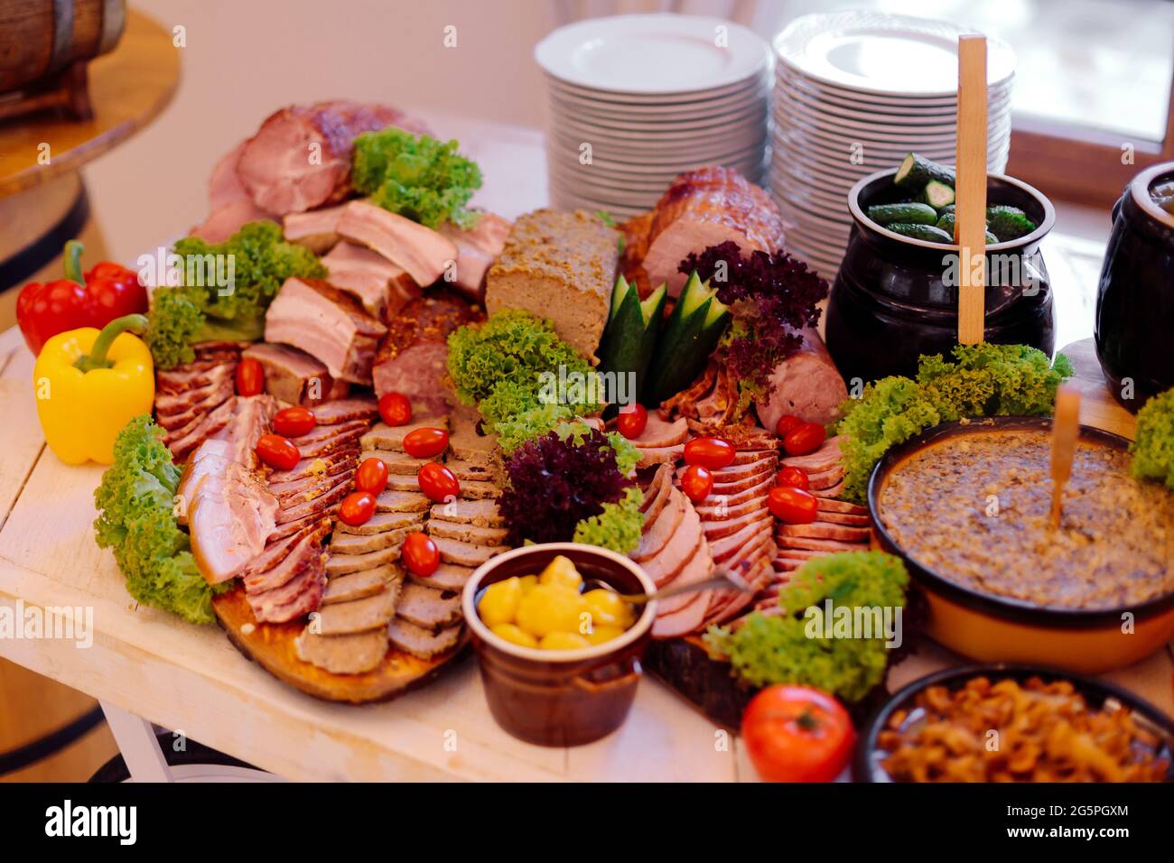 Varied meat buffet with boiled potatoes and fresh and salted vegetables in national cuisine restaurant. Recreation and entertainment. Local flavor. To Stock Photo