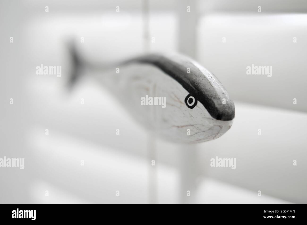 close up of decorative wooden fish in home interior Stock Photo