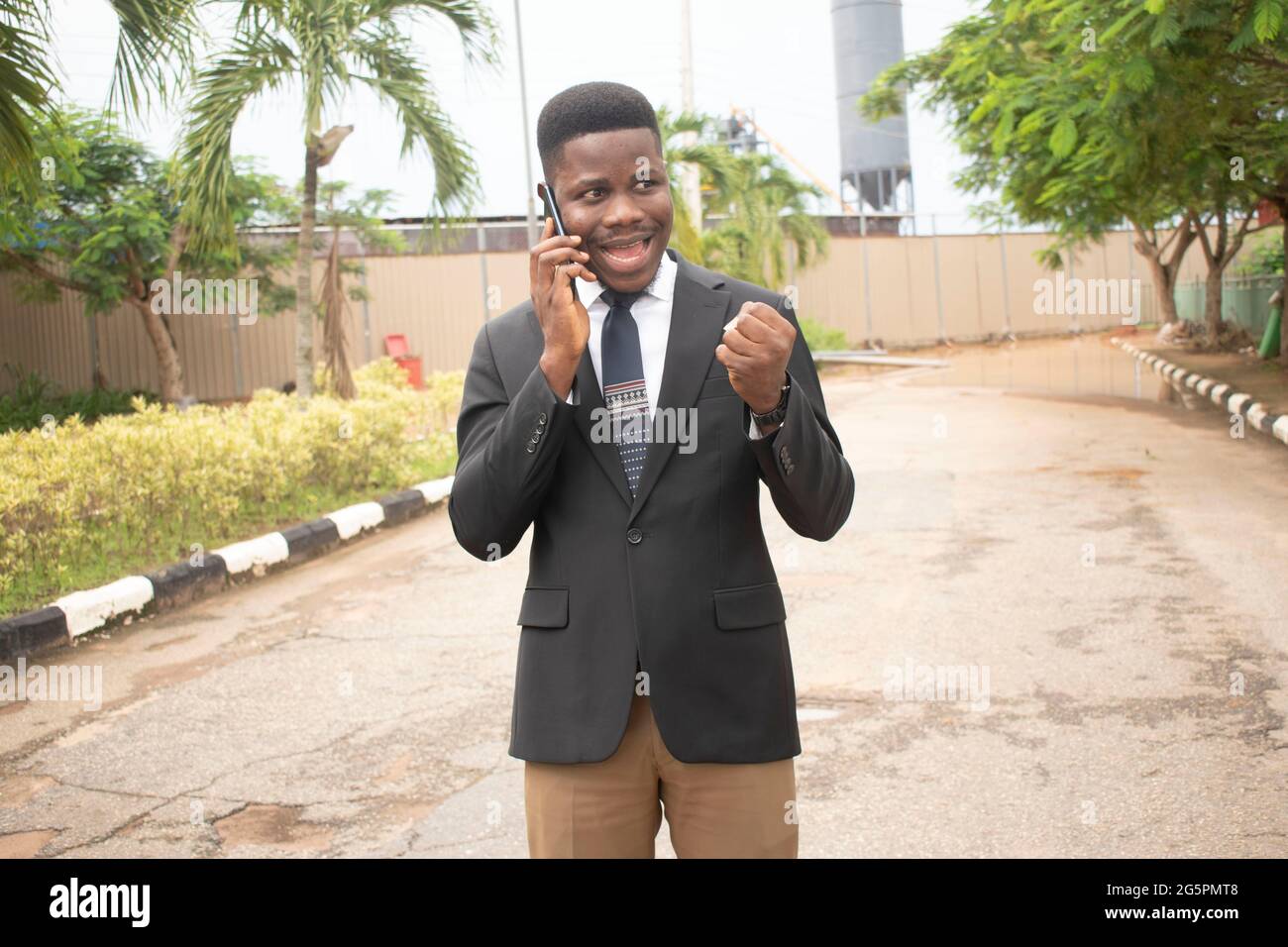 Image of handsome african businessman talking on cell phone Stock Photo