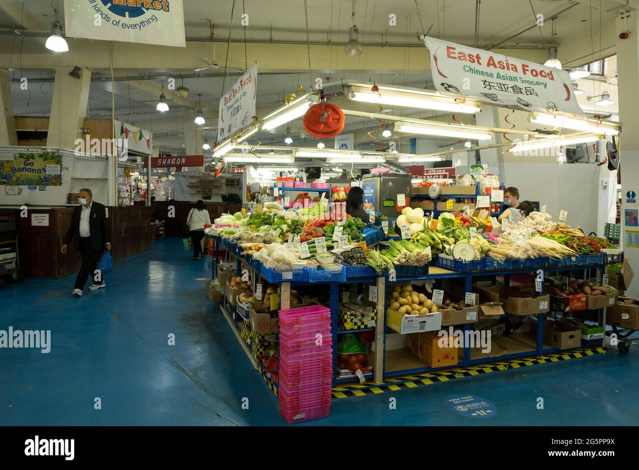 Interior of Coventry Market with fruit and vegetable stall in the UK