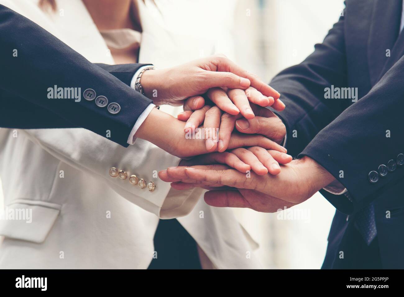 Teamwork Together Concept. Group of diversity people high five on air to greeting power of tag team. Multiethnic people group working togetherness. Vo Stock Photo
