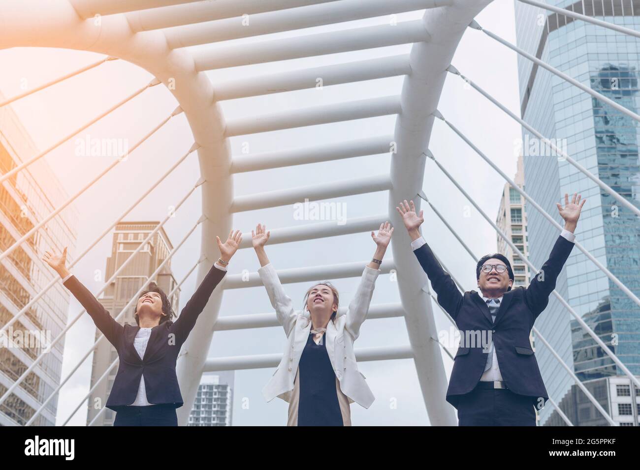 Teamwork Together Concept. Group of diversity people high five on air to greeting power of tag team. Multiethnic people group working togetherness. Vo Stock Photo