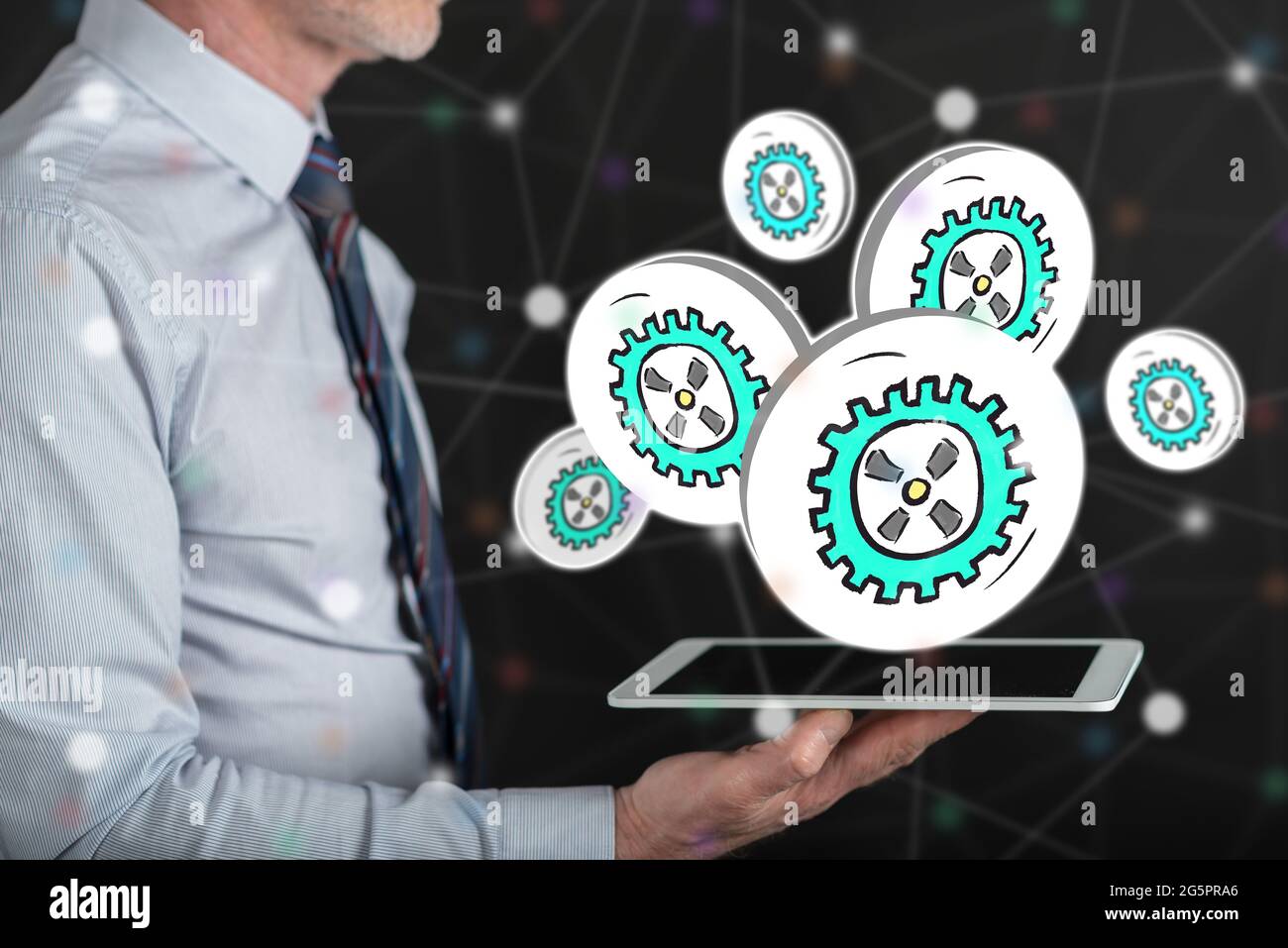 Business process concept above a tablet held by a man Stock Photo