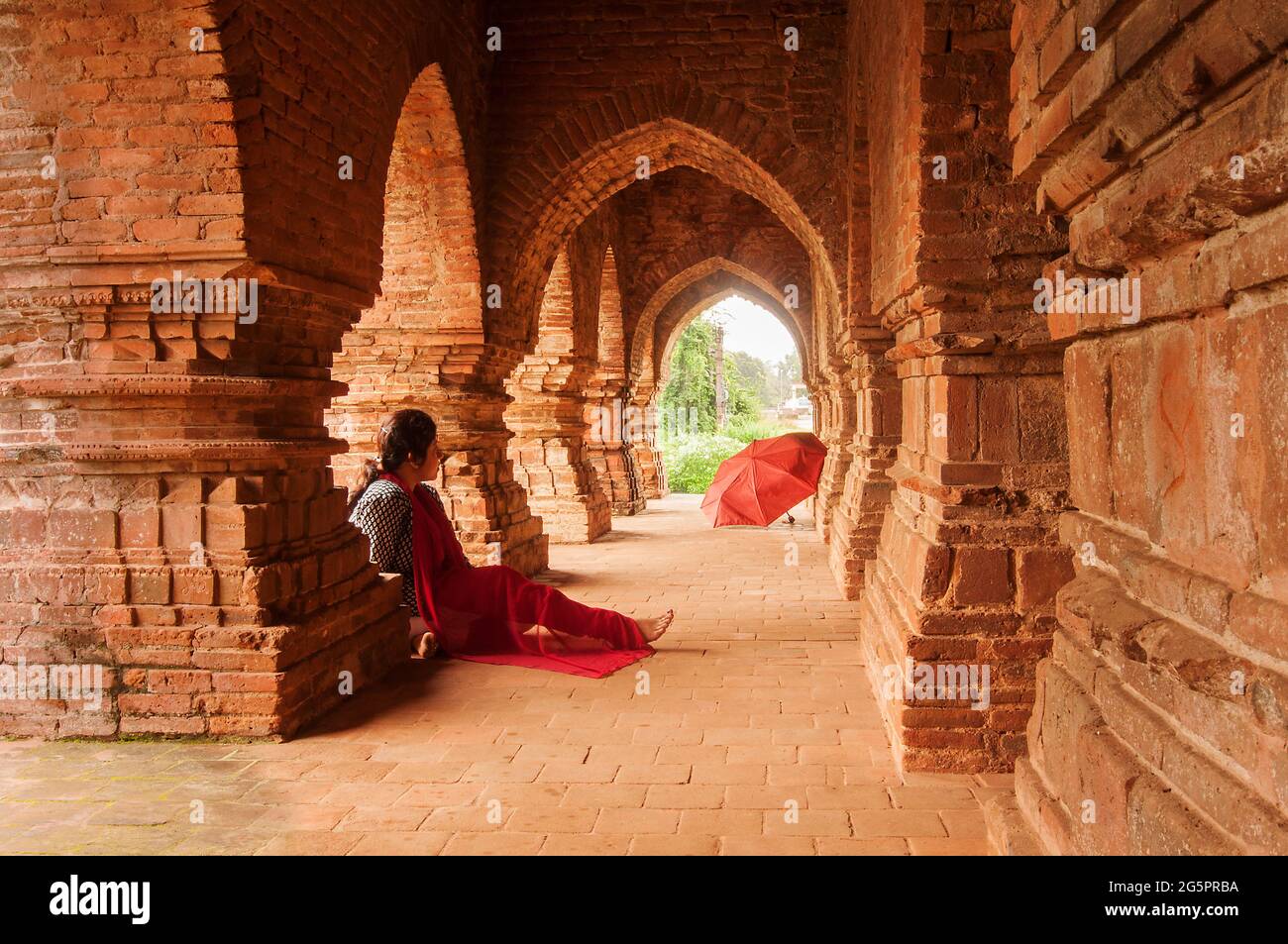 BISHNUPUR, WEST BENGAL / INDIA - OCTOBER 23, 2013 : Woman visitor at Rasmancha , old brick temple bulit in 1587. It is a famous world tourist spot in Stock Photo