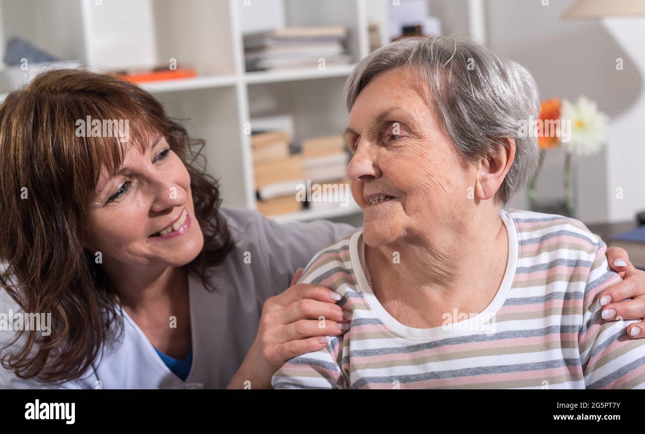 Nurse hands on shoulder hi-res stock photography and images - Alamy