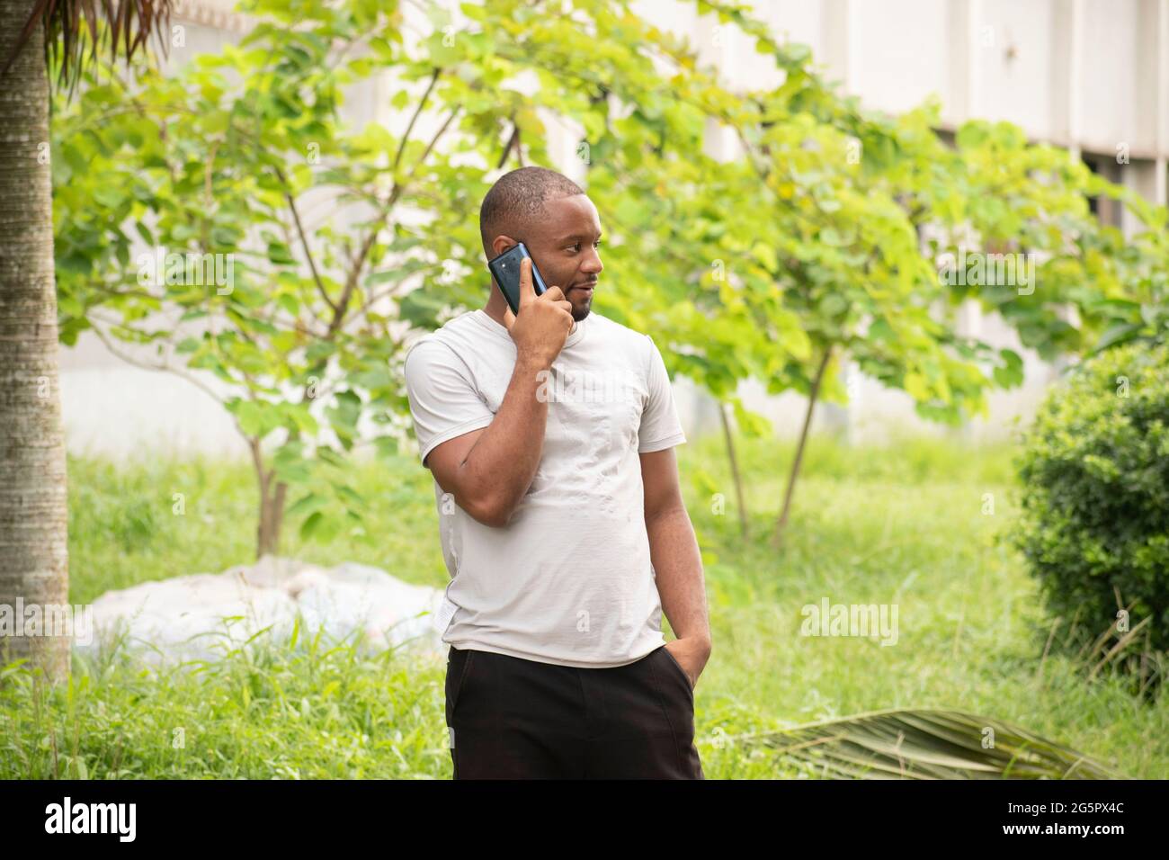 a young man talking on his phone Stock Photo