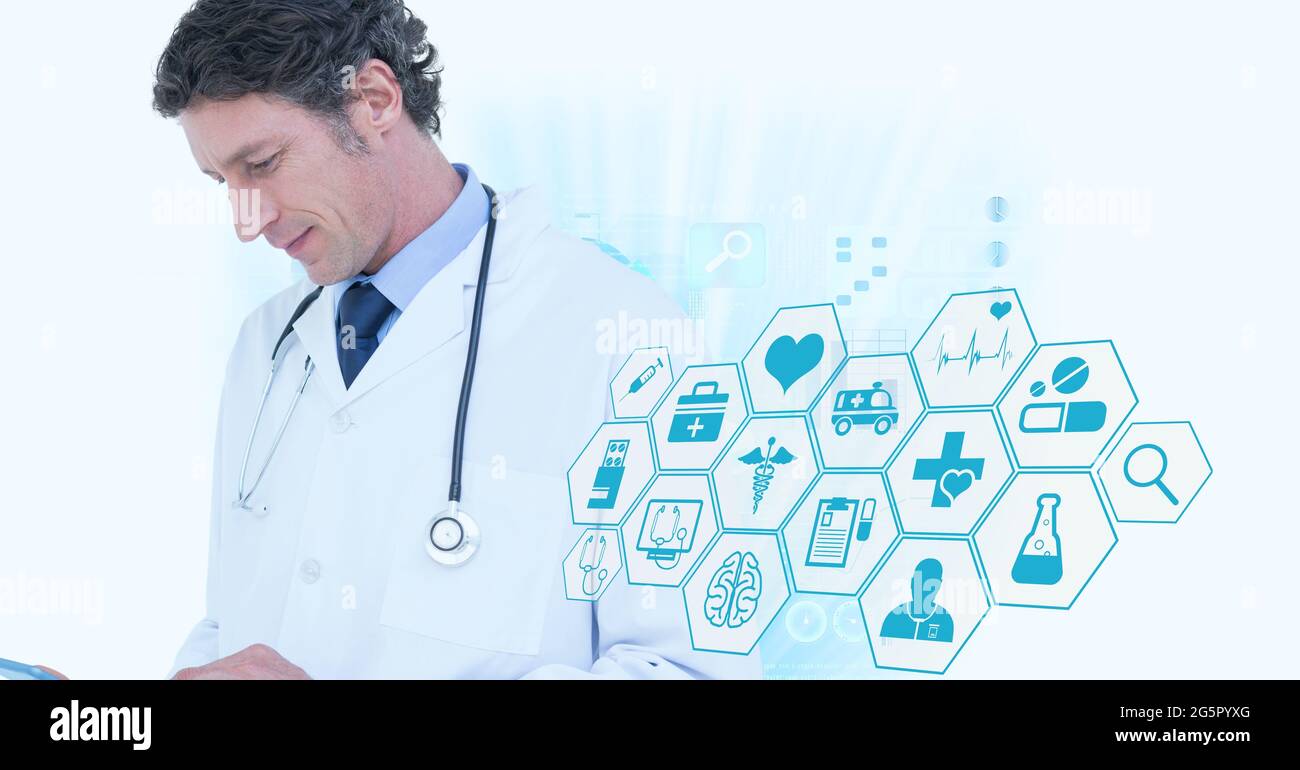 Male senior doctor using digital tablet against multiple medical icons ...