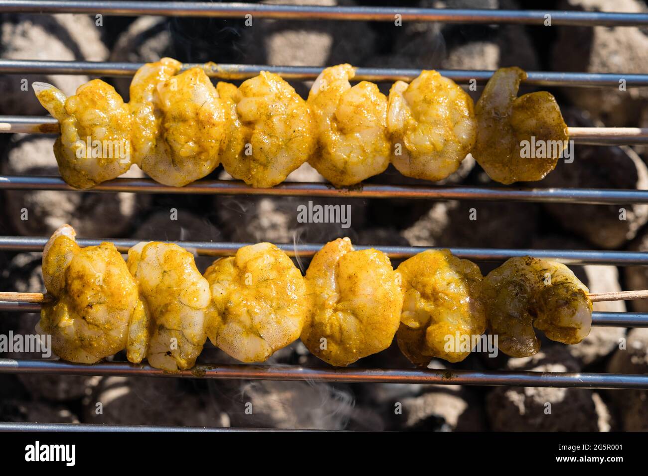 grilled White Tiger Prawns with Bacon Potato Salad Stock Photo