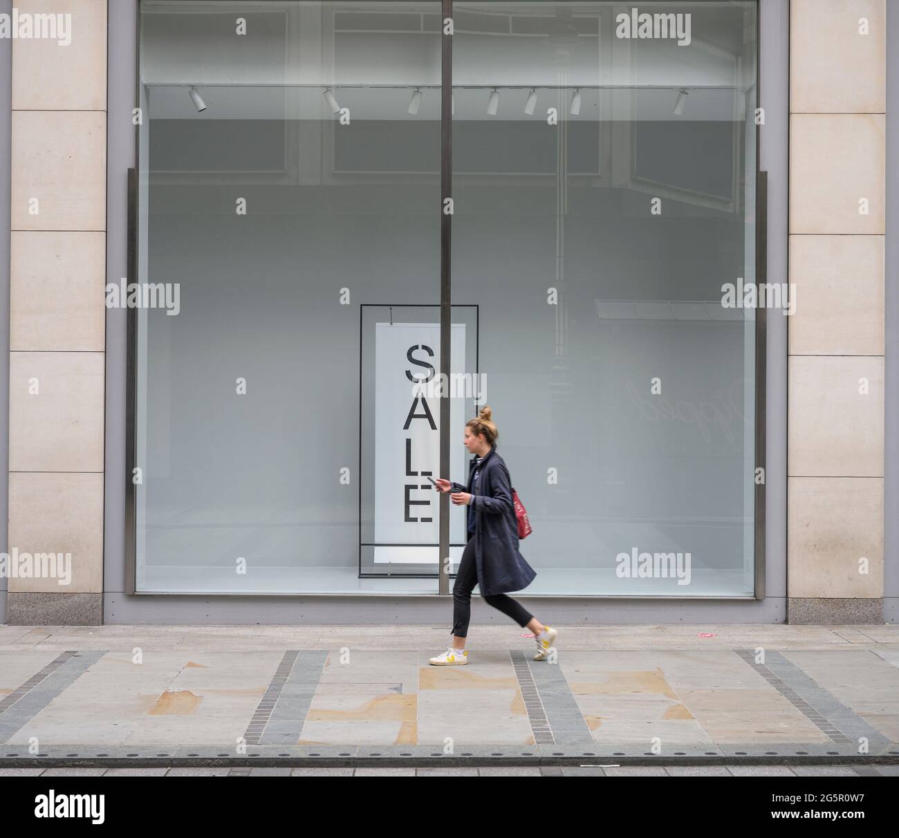 Oxford Street, London, UK. 29 June 2021. Austere window display with sale  sign at Zara store window facing New Bond Street on a dull summer day in  the capital. Credit: Malcolm Park/Alamy